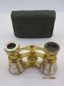 Pair of late 19th/early 20th century French mother-of-pearl and gilt metal adjustable opera