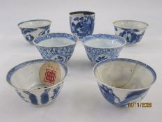 Two pairs of underglaze blue Chinese porcelain miniature tea bowls, two others and a porcelain
