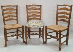Set of four ash and elm ladderback dining chairs with rush seats
