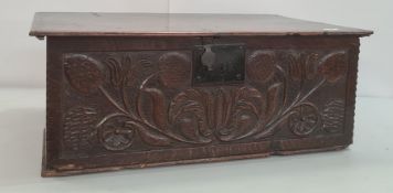 17th century oak bible box, the plain rectangular top, the carved front with tulips and other