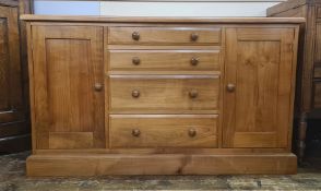 Modern cabinet/chest with four short drawers flanked by pair cupboards, 130cm wide