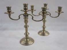 Pair of late 20th century silver-mounted three-branch candelabra on circular turned bases, London