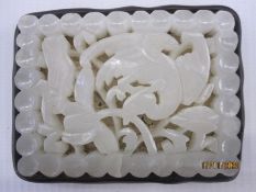 Chinese pale celadon carved jade openwork plaque, Ming dynasty, rectangular and carved with a wild