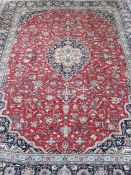 Persian Kashan carpet, the red ground field with stepped central medallion, the field decorated