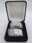 Pair of late 20th century silver napkin rings, oval, plain, cased, Sheffield 1997, 2ozt, maker