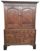 19th century oak linen press, the cavetto moulded cornice above two shaped panelled doors opening to