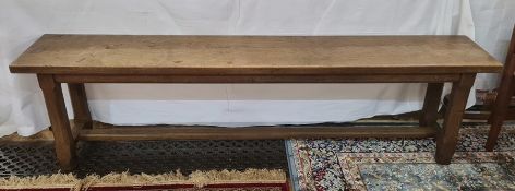 Pair of 20th century oak benches on chamfered supports, stretchered bases, 177cm long