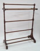Stained wood ring- turned five-bar towel rail