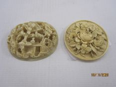 Two Chinese carved ivory miniature plaques, an oval example with figures beside wooded pavilions,