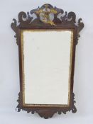 Chippendale-style mahogany and gilt wall mirror, the pierced scroll pediment with gilt bird