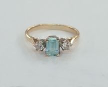Gold coloured metal, diamond and aquamarine-coloured stone ring set central rectangular blue stone