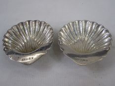 A pair of 1950s silver trinket dishes, scallop shaped, Birmingham 1956, makers William Suckling Ltd,