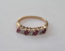 9ct gold, ruby and diamond ring set four elliptical rubies interpersed by three small diamonds