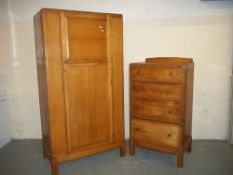 AN OAK TWO PIECE BEDROOM SET TO INCLUDE A WARDROBE AND A CHEST OF DRAWERS