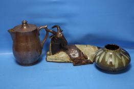 A STONEWARE LIDDED JUG, A VASE AND A FIGURE OF A GOAT