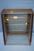A VINTAGE UPRIGHT SHOP COUNTER TOP DISPLAY CABINET, WOOD FRAME AND GLAZED, FITTED WITH THREE