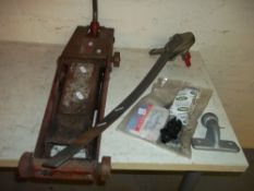 A VINTAGE TROLLEY JACK AND TOWING ACCESSORIES