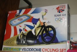 A BOXED SCALEXTRIC CYCLING VELODROME SET TOGETHER WITH DAYS GONE COMMONWEALTH GAMES VEHICLES ETC.