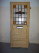 A VINTAGE HARDWOOD FRONT DOOR WITH LEADED GLASS
