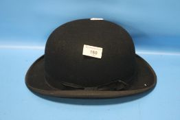 EQUESTRIAN BOWLER HAT BY G. A. DUNN & CO LTD., BLACK WITH SHAPED BRIM, RED SATIN LINING, SILK EDGING