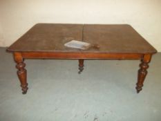 A LARGE OAK WIND-OUT TABLE WITH HANDLE, CENTRE PIECE MISSING, BASE IS WORMED IN PLACES, L 3 m,