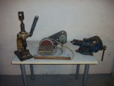 AN ENGINEER'S SWIVEL VICE, A HAND PRESS AND A POWERED SANDER