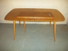 AN EXTENDING ERCOL DINING TABLE