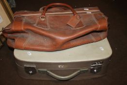 A VINTAGE LEATHER BAG AND A SUITCASE