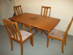 A MODERN TEAK DROP LEAF DINING TABLE AND FOUR CHAIRSCondition Report:SOME FADING AND LIGHT WEAR