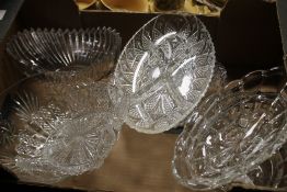 A TRAY OF ASSORTED GLASS DISHES