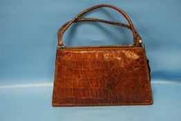 A VINTAGE CROCODILE SKIN HANDBAG