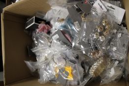 A BOX OF ASSORTED NEW COSTUME JEWELLERY A/F