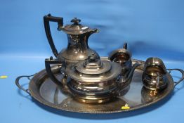 A HALLMARKED SILVER TEA SET ON TRAY COMPRISING TEAPOT, HOT WATER JUG, MILK AND SUGAR