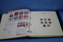 AN ALBUM OF MAINLY US AND BRITISH STAMPS, VIC - QEII TO INCLUDE MINT AND USED TYPES, FIRST DAY