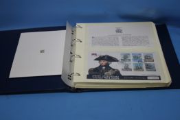 AN ALBUM OF COIN AND STAMP COVERS, MOSTLY OF MILITARY AND AVIATION INTEREST TO INCLUDE EXAMPLES