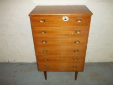 A VINTAGE CHEST OF DRAWERS