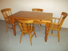 A PINE DINING SET WITH FOUR CHAIRS