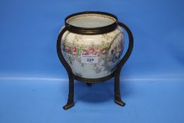 A BEEHIVE CHINA POT MOUNTED IN A BRASS STAND