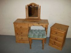 A PINE DRESSING TABLE WITH MIRROR AND A THREE DRAWER CHEST