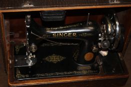 A CASED SINGER SEWING MACHINE