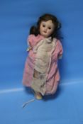 A 19TH CENTURY FRENCH BISQUE HEADED DOLL