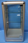 A GLAZED TABLE TOP DISPLAY CABINET WITH FITTED GLASS SHELVES, H 70 CM, W 36 CM D 36 CM