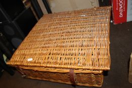 A WICKER PICNIC BASKET