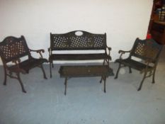 A CAST IRON FOUR PIECE GARDEN BENCH SET