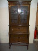 AN OAK BUREAU BOOKCASE
