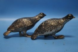 TWO WHITE METAL PARTRIDGES