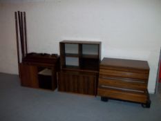 A MODULAR BOOKSHELF STORAGE SYSTEM IN ROSEWOOD FINISH