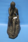 A CLAY FIGURE OF A SEATED LADY, H 31 CM