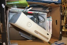 AN X-BOX 360 TOGETHER WITH A SMALL COLLECTION OF WII GAMES