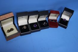 FOUR BOXED LADIES' DRESS RINGS TOGETHER WITH TWO PAIRS OF EARRINGS